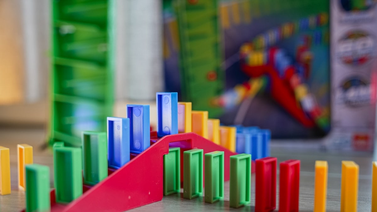A close up of a game of dominos on a table
